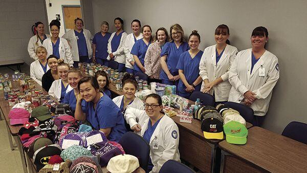 MAKING A DIFFERENCE: Students at Cleveland State Community College help local cancer patients stay warm